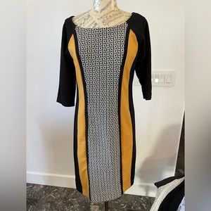 Great work dress in knit. Combo of pattern and solid colors is eye catching.